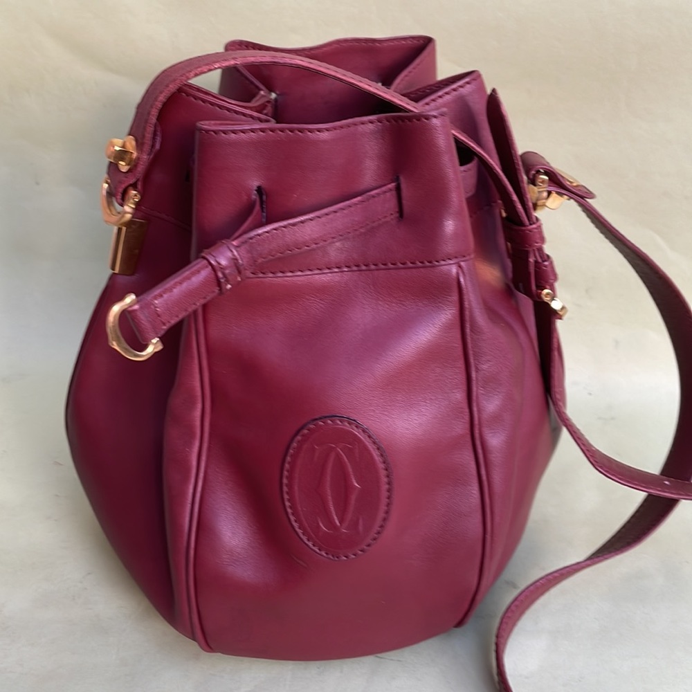 Burgundy/gold Cartier leather bucket bag